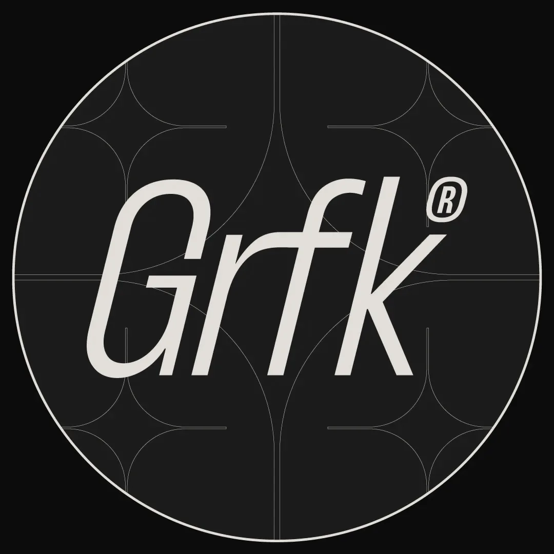 Grafika logomark on a deep red roundel